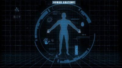 Futuristic digital display showing a human body silhouette with medical data and diagnostics